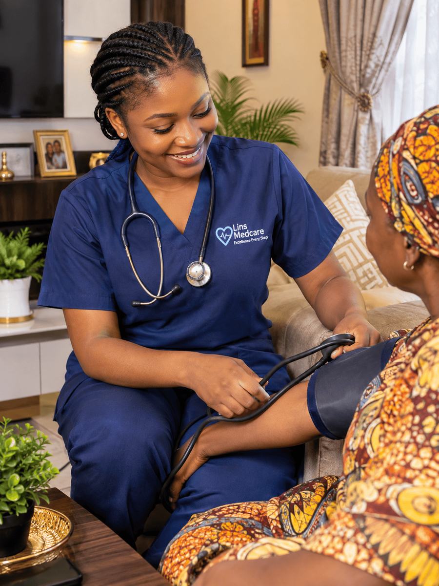 A Lins Medcare nurse checking an older woman's blood pressure in her living room